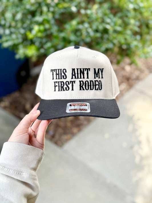 THIS AIN'T MY FIRST RODEO TRUCKER HAT