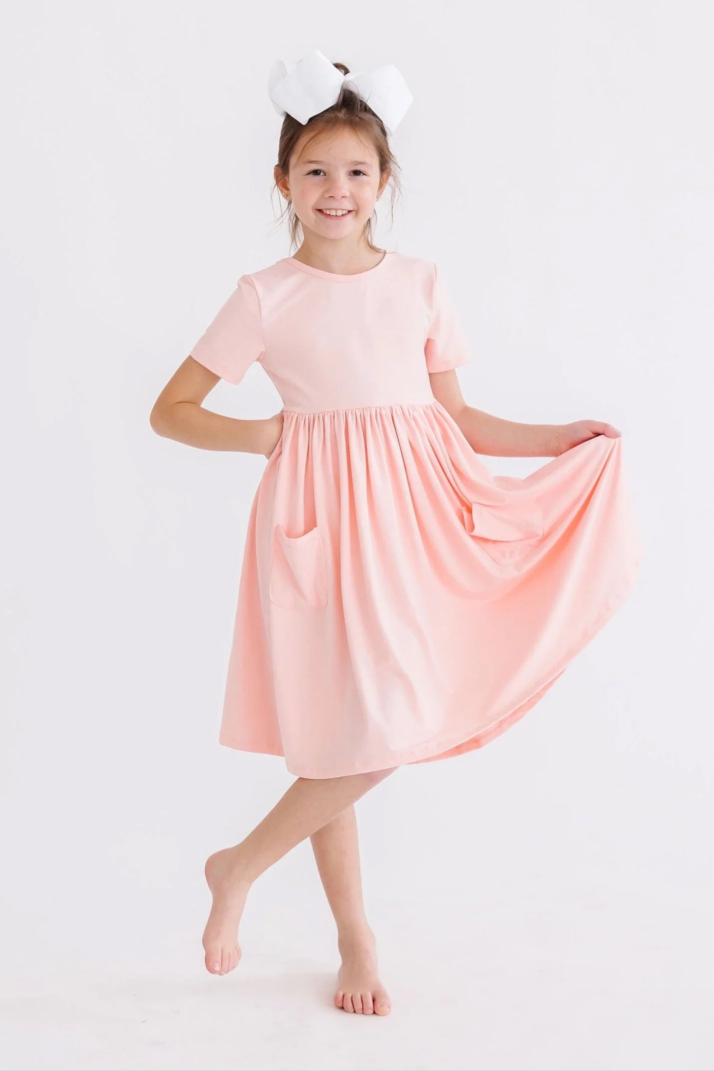 CARLY TWIRL DRESS - PEACH