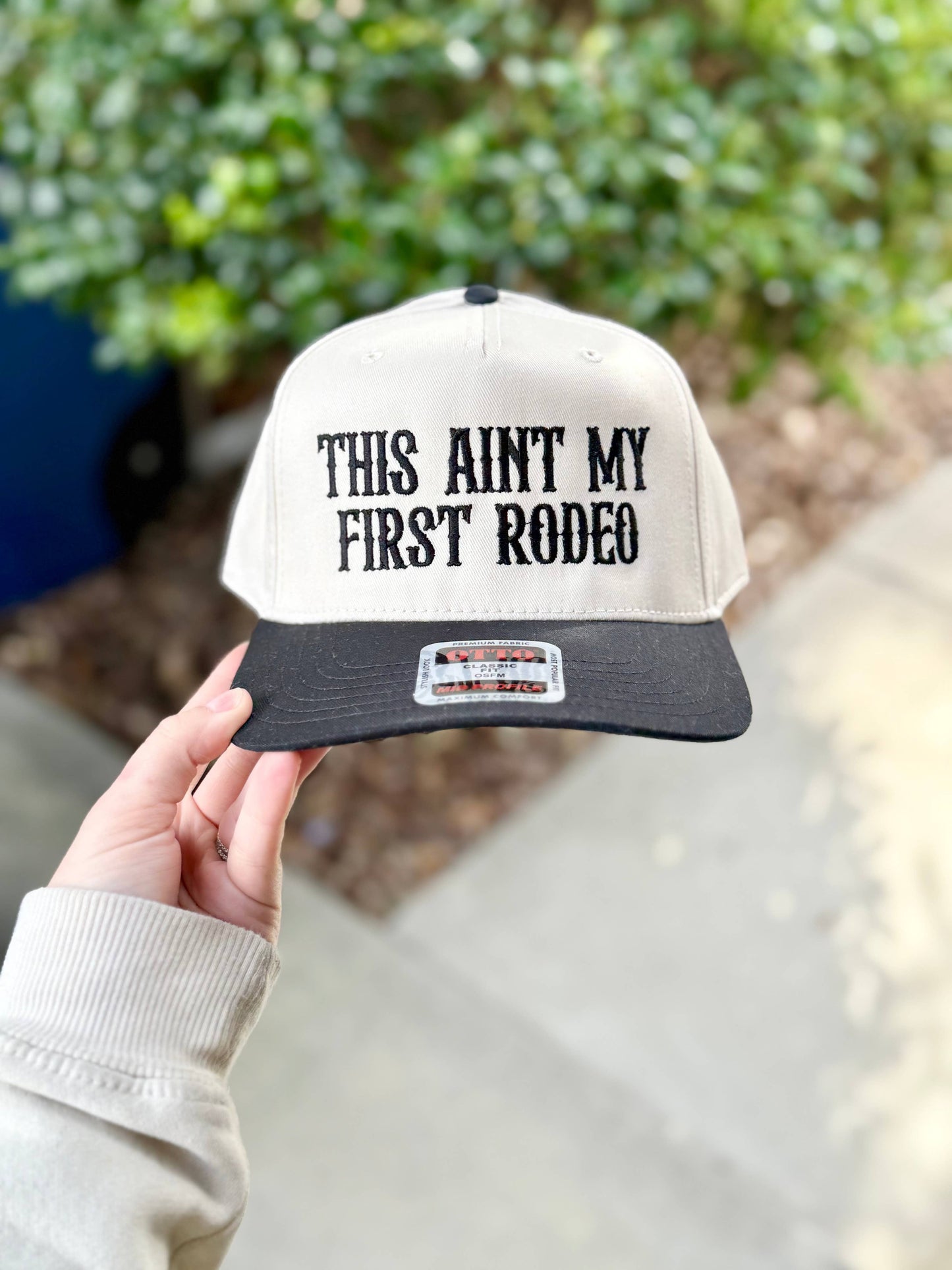 THIS AIN'T MY FIRST RODEO TRUCKER HAT
